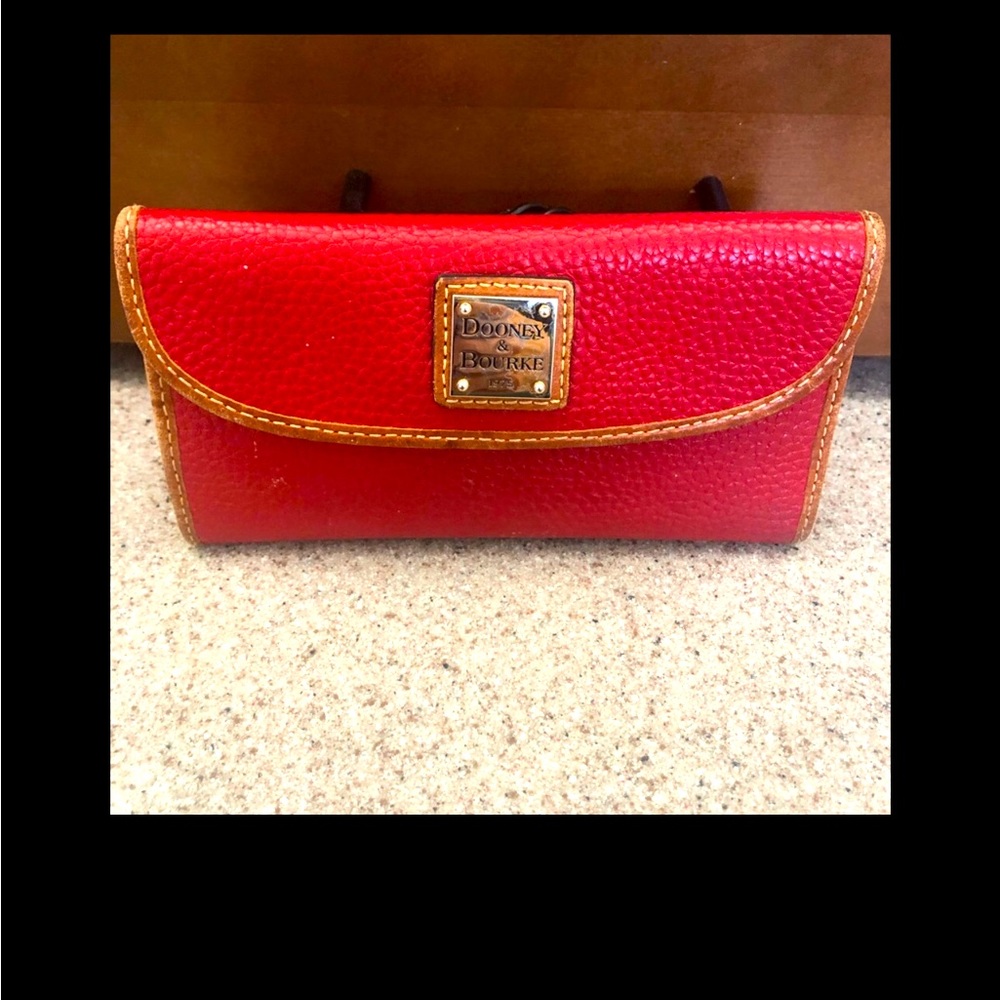 Beautiful pebble leather wallet with gold DB on front.